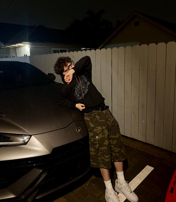 Colin Allen (thatiscolin) with Lamborghini Colin Allen also known as thatiscolin posing with a Lamborghini during a lifestyle photoshoot