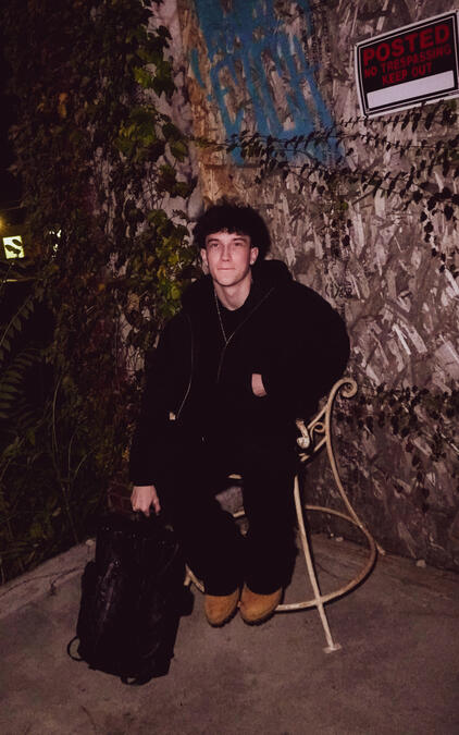 Colin Allen also known as thatiscolin modeling while seated during a professional photoshoot